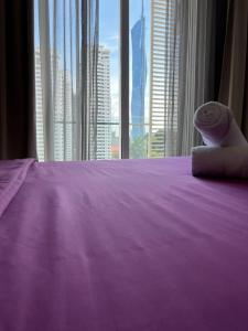 Ένα ή περισσότερα κρεβάτια σε δωμάτιο στο City Home Suites Kuala Lumpur City Centre