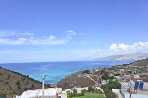 a view of the ocean from a hill at SEA & LAKE VIEW VILLA in (( Kalive Gjoka ))