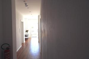 an open hallway with a hallway leading to a living room at SEA & LAKE VIEW VILLA in (( Kalive Gjoka ))