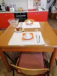 a wooden table with a plate of food on it at Bella Vigezzo in Craveggia