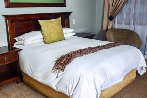 Ein Bett oder Betten in einem Zimmer der Unterkunft Komani Resorts