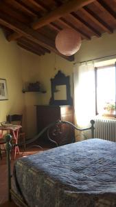 Un pat sau paturi într-o cameră la Cottage La Spagna