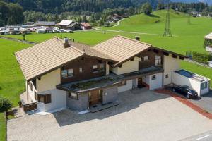 an overhead view of a house with a roof at T3 Pension Wald am Arlberg in Wald am Arlberg