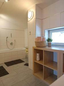 a bathroom with a sink and a bath tub at Ferienwohnung Sonja in Bach