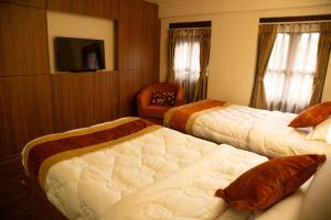 Hotel Traditional客房内的一张或多张床位