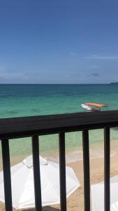 a view of the beach from the balcony of a resort at baru express in Cartagena de Indias