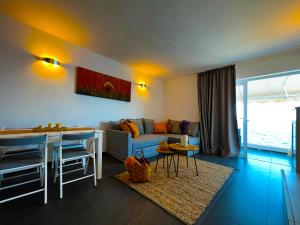 a living room with a couch and a table at At the ocean’s edge in Callao Salvaje