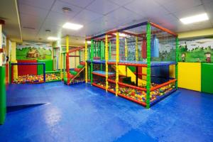 a childrens play room with a roller coaster at Aparthotel AnyosPark Mountain & Wellness Resort in Anyós