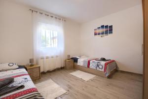 Posteľ alebo postele v izbe v ubytovaní Apartment Buddy
