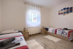Postel nebo postele na pokoji v ubytování Apartment Buddy