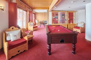 a billiard room with a pool table in a room at Hôtel L'Eden des Cimes - Vacances Bleues - Belle Plagne 2100 in Belle Plagne