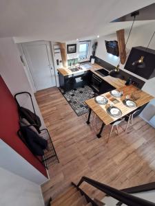 an aerial view of a living room with a table at Nantes panoramique in Nantes