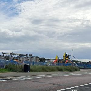 a park with a playground with a roller coaster at Maze Beach Getaway in Ayr