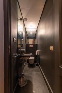 a small bathroom with a toilet and a sink at Corte Satriano Residence in Naples