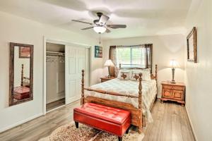 a bedroom with a bed and a ceiling fan at Fort Worth Retreat with Fenced Yard and Fire Pit! in Fort Worth