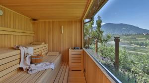 a sauna with a view of a mountain at Hotel Weingut Innerleiterhof in Schenna