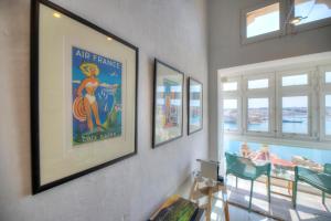 a room with three framed pictures on the wall at Spacious maisonette with spectacular views IBRI1-1 in Valletta