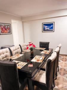 a dining room with a table and chairs at Apart La Merced in Caraz