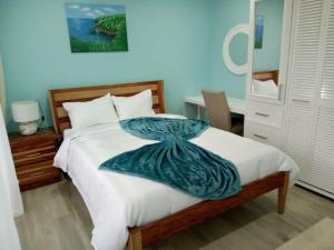 Postel nebo postele na pokoji v ubytování JemmRose Suites