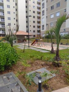 a park with a playground and a play equipment at Apartamento em Condomínio Frente Mar Barra Velha-SC in Barra Velha