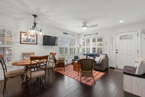 a living room with a table and a couch at Weeden Cottage in St. Augustine