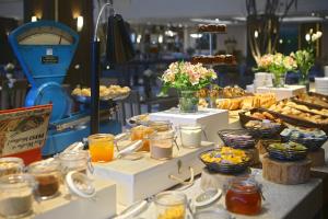 a buffet of food on a table in a store at Prodigy Gramado in Gramado