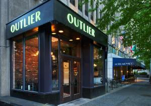 a store front of a building with a sign on it at Kimpton Hotel Monaco Seattle, an IHG Hotel in Seattle