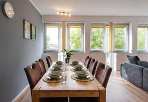 a dining room with a table and chairs at Working Loft Emmerich - 8 box spring beds in Emmerich