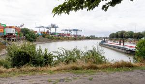 a river with a boat on the side of it at Working Loft Emmerich - 8 box spring beds in Emmerich