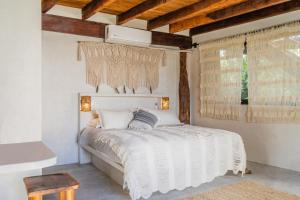 Ένα ή περισσότερα κρεβάτια σε δωμάτιο στο Amansala Resort