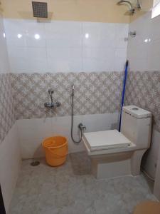 a small bathroom with a toilet and a shower at 3 BHK-Air Coolers for 4 to 10 Guests for Families in Hyderabad