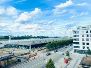 an aerial view of a city with a ferris wheel at Riverview Studio in Historical Heart of Antwerp in Antwerp