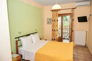 Postel nebo postele na pokoji v ubytování Guesthouse Papastathis