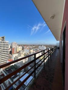 a balcony of a building with a view of a city at Los Petos - Playa Grande in Mar del Plata