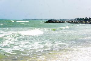 a body of water with waves in the ocean at Moven Paradise in Accra