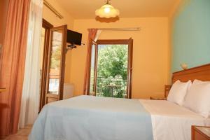 Postel nebo postele na pokoji v ubytování Guesthouse Papastathis