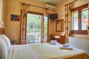 Postel nebo postele na pokoji v ubytování Guesthouse Papastathis + 37 fotografií
