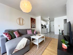 a living room with a couch and a table at 18-26-30 Saint-Joseph Est in Quebec City +69 photos