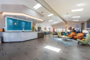 a lobby of a hospital with couches and chairs at San Clemente Inn in San Clemente