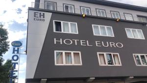 a building with the words hotel eurooca on it at Eurohotel in Piacenza