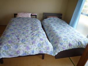 A bed or beds in a room at Futami Terrace C