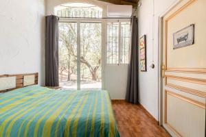 Łóżko lub łóżka w pokoju w obiekcie Casa Rural Navalonguilla con piscina