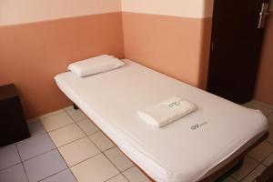A bed or beds in a room at GV Hotel - Sogod