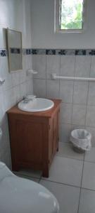 a bathroom with a sink and a mirror at Hospedaje Franco-Peruano El Tambito in Sauce