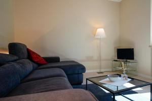 a living room with a couch and a coffee table at Surville in Aosta