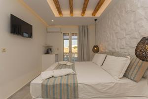 Posteľ alebo postele v izbe v ubytovaní Kallithea Hotel + 37 fotografií