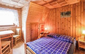 Posteľ alebo postele v izbe v ubytovaní Holiday Home Mragowo Czerwonki