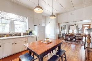 a kitchen with a wooden table and a dining room at Liberty Creek in Fredericksburg