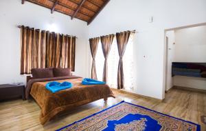 Postel nebo postele na pokoji v ubytování The Nest bettathur, Coorg