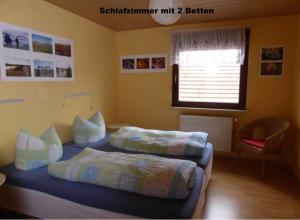 Postel nebo postele na pokoji v ubytování Schöne Unterkunft in idyllisch ländlicher Lage